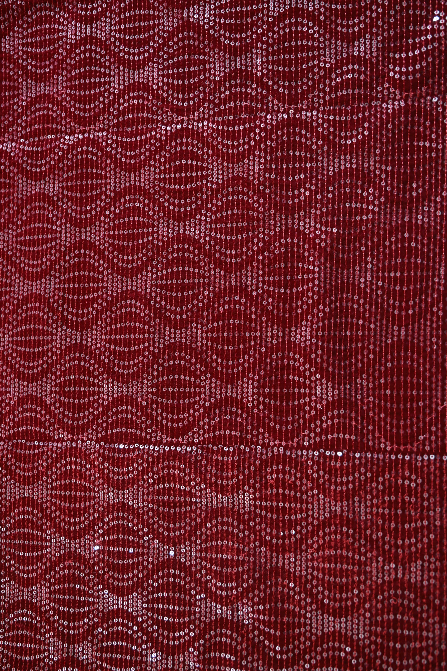 red sequin velvet with a textured pattern
