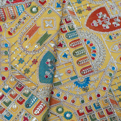 Yellow; embroidered fabric with intricate, colorfull patterns